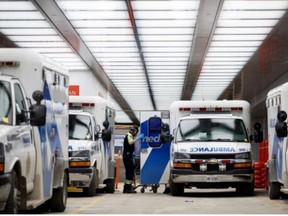 Paramedics unload a patient at Mount Sinai Hospital on Jan. 3, 2022.