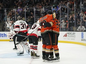 Ducks centre Derek Grant, right, celebrates with Jakob Silfverberg after scoring against Senators goaltender Anton Forsberg in teh second period of the teams' Nov. 26 game in Anaheim. The Ducks won 4-0.