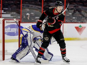 Ottawa Senators left wing Brady Tkachuk (7) screens Buffalo Sabres goaltender Michael Houser (32) during the first period at the Canadian Tire Centre on Jan. 18, 2022.