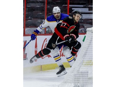 Ottawa Senators centre Dylan Gambrell (27) and Buffalo Sabres defenceman Mattias Samuelsson tangle during the first period.