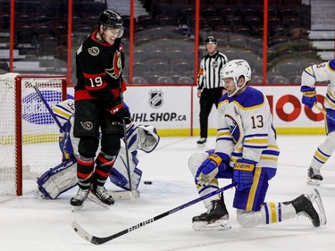 A shot gets past Buffalo Sabres defenceman Mark Pysyk with Ottawa Senators right wing Drake Batherson in behind him during the first period.