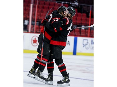 Ottawa Senators right wing Tyler Ennis (63) is congratulated on his hat-trick goal by teammate Thomas Chabot late in the third period.