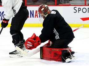 Filip Gustavsson makes a save during practice at the Canadian Tire Centre on Wednesday, Feb. 16, 2022.