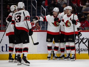 Ottawa Senators forward Adam Gaudette (17) celebrates with teammates after scoring a goal against the Washington Capitals during the first period on Sunday at Capital One Arena.