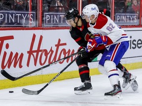 Ottawa Senators defenceman Artem Zub (2) battles with Montreal Canadiens left wing Artturi Lehkonen (62) during second period NHL action at the Canadian Tire Centre, May 5, 2021.