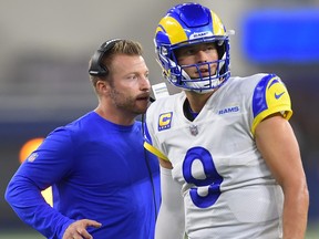 Rams head coach Sean McVay talks with quarterback Matthew Stafford (9) during a time out in the fourth quarter of the game against the Chicago Bears at SoFi Stadium.