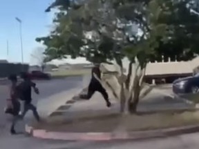 Screen shot of teacher being chased down by middle school students in Texas.