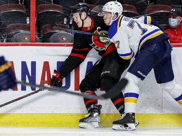 Ottawa Senators left wing Brady Tkachuk (7) is checked by St. Louis Blues defenceman Niko Mikkola (77) during the third period.