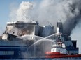 Smoke rises from the Italian-flagged Euroferry Olympia, which sailed from Greece to Italy early on Friday and caught fire, off the coast of Corfu, Greece, February 19, 2022.