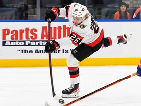 Ottawa Senators defenceman Erik Brannstrom (26) attempts a shot against the New York Islanders during the first period at UBS Arena, Feb. 1, 2022.