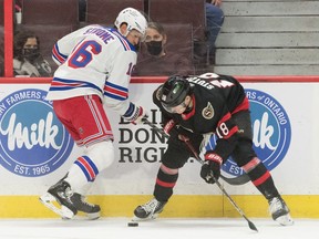 New York Rangers centre Ryan Strome (16) battles with Ottawa Senators left wing Tim Stuetzle (18) in the first period at the Canadian Tire Centre, Sunday, Feb. 20, 2022.