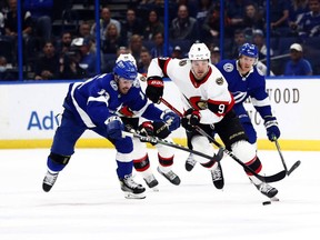 Ottawa Senators centre Josh Norris (9) skates with the puck as Tampa Bay Lightning left wing Boris Katchouk (13) defends during the first period at Amalie Arena, Dec. 16, 2021.