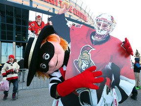 Hamburglar shows some love for Andrew Hammond before the game opposing the Ottawa Senators and the Boston Bruins, March 19, 2015.