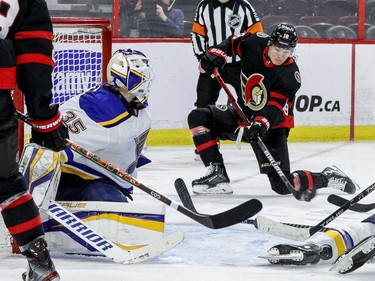 The Ottawa Senators' Tim Stuetzle (18) fires a shot on St. Louis Blues goaltender Ville Husso (35) during the third period.