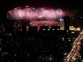 A general view of the city as fireworks explode over the National Stadium, also known as the Bird's Nest, at the end of the closing ceremony of the Beijing 2022 Winter Olympics, in Beijing, China February 20, 2022.