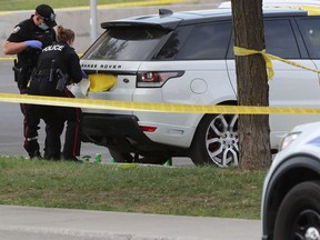 Ottawa police shown in this file photo at the scene of a multiple shooting on Alta Vista Drive on May 28, 2021.