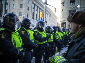 Police from all different forces across the country joined together to try to bring the "Freedom Convoy" occupation to an end on Saturday, Feb. 19, 2022. Early Saturday evening, police held the line across Bank Street.