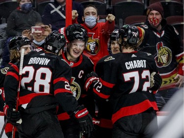 Ottawa Senators left wing Brady Tkachuk (7) is congratulated by Thomas Chabot and other teammates on his goal against the Minnesota Wild during the first period at the Canadian Tire Centre on Tuesday, Feb. 22, 2022. Chabot had an assist on the play, one of his three points on the night.