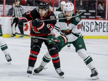 Ottawa Senators right wing Tyler Ennis (63) and Minnesota Wild centre Frederick Gaudreau (89) during the first period.