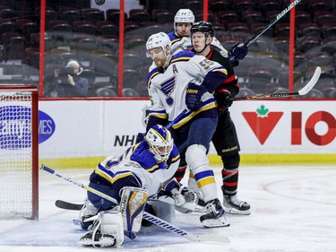 Ottawa Senators left wing Brady Tkachuk (7) battles defenceman Colton Parayko (55) and defenceman Niko Mikkola (77) for a loose puck after goaltender Ville Husso (35) made a save during the first period.