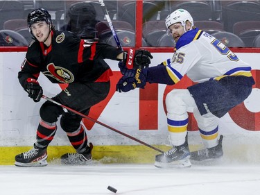 Ottawa Senators left wing Alex Formenton (10) and St. Louis Blues defenceman Colton Parayko (55) follow a loose puck during the first period at the Canadian Tire Centre on Tuesday, Feb. 15,2022.