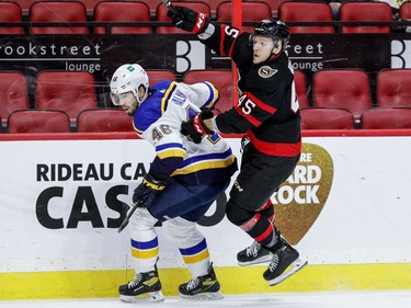 Ottawa Senators left wing Parker Kelly (45) gets past the check of St. Louis Blues defenceman Jake Walman (46) during the first period.