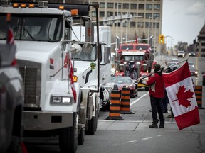 A group of demonstrators were out to support a passing convoy of anti-mandate motorists that rolled through Ottawa's downtown on Saturday.



ASHLEY FRASER, POSTMEDIA