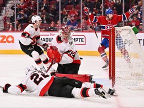 Senators’ goaltender Filip Gustavsson looks behind him as the puck sits in his net on a goal by the Canadiens in Montreal last night.