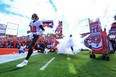 Tom Brady of the Tampa Bay Buccaneers runs onto the field before the game against the Los Angeles Rams.