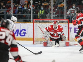 Ottawa 67’s goalie Will Cranley makes a save against Declan McDonnell of the Barrie Colts yesterday at TD Place.