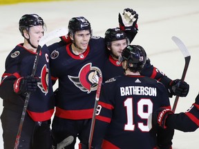 Ottawa Senators' Artem Zub (2) celebrates after scoring a goal with teammates Brady Tkachuk (7), Erik Brannstrom (26), and Drake Batherson (19).