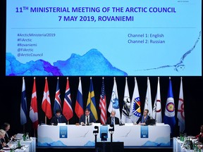 Finland's foreign minister Timo Soini, second from left, welcomes participants attending the 11th Ministerial Meeting of the Arctic Council in Rovaniemi, Finland on May 7, 2019.