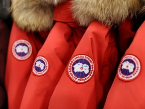 Labels are seen on Canada Goose jackets in a store in Manhattan, Feb. 7, 2022.