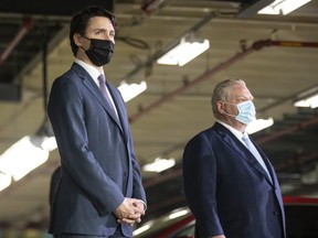 Prime Minister Justin Trudeau (left) stands alongside Ontario Premier Doug Ford as they make an announcement at a Honda plant in Alliston March 16, 2022.