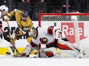Ottawa Senators goalie Anton Forsberg defends his net against William Carrier of the Vegas Golden Knights on Sunday at T-Mobile Arena. Forsberg made 40 save in his team's 2-1 loss.