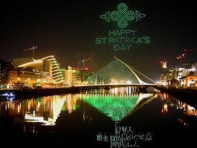 A display by Tourism Ireland entitled "Orchestra of Light" featuring a swarm of 500 drones is animated in the night sky above the Samuel Beckett bridge on the river Liffey for St Patrick's Day in Dublin, Ireland, March 7, 2021.