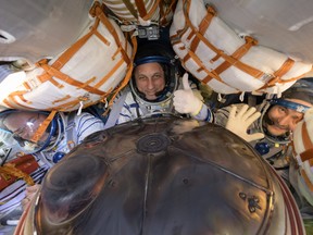 In this handout image provided by the U.S. National Aeronatics and Space Administration (NASA), Expedition 66 crew members (left to right) Mark Vande Hei of NASA, cosmonauts Anton Shkaplerov and Pyotr Dubrov of Roscosmos, are seen inside their Soyuz MS-19 spacecraft after is landed in a remote area near the town of Zhezkazgan on March 30, 2022 in Zhezkazgan, Kazakhstan.