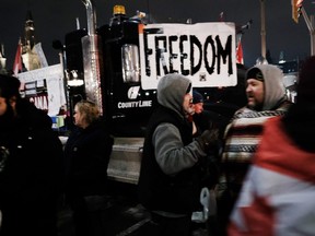 Truck drivers and their supporters gather to block the streets as part of a convoy of truck protesters against COVID-19 mandates, in Ottawa, Feb. 9, 2022.