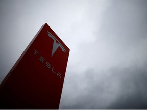 The logo of Tesla is pictured at a dealership in Chambourcy, near Paris, France, Dec. 15, 2021.