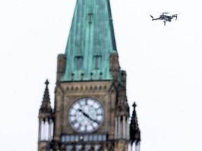 A police drone flies near Parliament Hill as police work to evict the last of the trucks and supporters occupying the downtown core on Feb. 20.