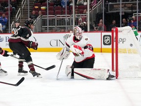 Coyotes centre Nick Schmaltz (8) scores a goal against Senators netminder Matt Murray during the second period. It was one of a franchise-record seven points in the game for Schmaltz.