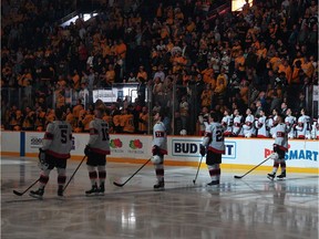 Ottawa Senators and Nashville Predators players observe a moment of silence on Tuesday night following the passing of Senators owner Eugene Melnyk.