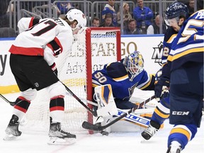 St. Louis Blues goaltender Jordan Binnington makes a save against Ottawa Senator Adam Gaudette during the first period at Enterprise Center.