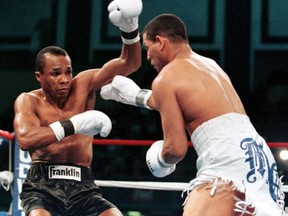 Hector "Macho" Camacho hammers Sugar Ray Leonard in a 1997 title bout.