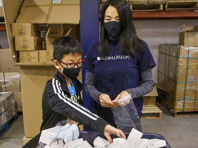 Nathan spent his ninth birthday volunteering with his mother Lina Yuan at GlobalMedic in Etobicoke on Friday, March 25, 2022.