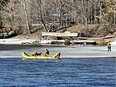 Ottawa firefighters were able to save two men and their dog from the Rideau River Monday.