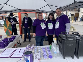 Haizel Reggler, middle, participates in Purple Day in Ottawa on Saturday with her parents Dave, right, and Sandi. Haizel, now 12, was diagnosed with epilepsy four years ago.