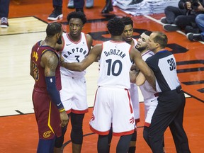 Toronto Raptors Fred VanVleet is held back during 1st half action against Cleveland Cavaliers LeBron James in Eastern Conference Semifinals at the Air Canada Centre at the Air Canada Centre in Toronto, Ont. on Tuesday May 1, 2018.