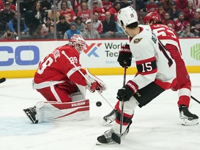 Detroit Red Wings goaltender Alex Nedeljkovic stops a Ottawa Senators defenceman Michael Del Zotto (15) shot.