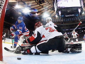 Kaapo Kakko of the New York Rangers scores a first period goal against Anders Nilsson of the Ottawa Senators.